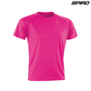 A pink adult performance T-shirt with short sleeves and a seamless design, featuring a logo in the corner.
