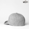 A grey fitted cap with a smooth texture, featuring a rounded crown and a slightly curved brim. Includes a logo.