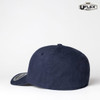 A navy blue fitted cap with a rounded crown and a branded logo on the side.