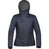 A women's puffer jacket in navy blue with a hood and zippered pockets, featuring a logo.