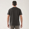 A black short sleeve tee, featuring a simple design and a logo on the back. The model stands facing away from the camera.