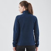A navy women's fleece jumper with a 1/4 zip and a fitted design, featuring a logo on the back.