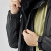 A close-up of a black jacket being unzipped, showcasing its interior lining and zip details.