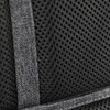 Black mesh fabric detail with stitching from a backpack, featuring a textured pattern and reinforcement tape.