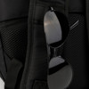 A black backpack with a mesh pocket and a pair of black sunglasses hanging from it. It features a logo.