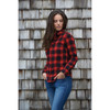 A women's red and black checkered button-up shirt with a snap front, worn by a model against a wooden background.