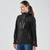 A black women's softshell jacket featuring zippered pockets and a hood, with subtle reflective accents.
