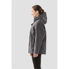 A women's grey Magellan System Jacket with a hood, featuring a branding logo, displayed from the side.