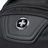A close-up of a black backpack featuring a logo and a zipped pocket. The material appears durable and textured.
