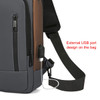 A grey and brown anti-theft sling bag with an external USB port and adjustable strap. It features zippered compartments.