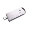 A metallic flash drive with a keyring attachment, featuring a sleek design and a small hole for connection.