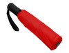 A red fold-up umbrella with a black handle and strap, closed and compact. It features a branding logo.