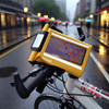 A yellow waterproof crossbody handlebar bag, featuring a clear top panel for a device, attached to a bicycle.