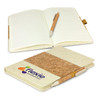 A cork and cream notebook set with an elastic band, featuring a matching pen inside. The notebook has a logo on its cover.