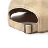 A beige cap with a buckle fastening, showcasing a textured fabric and a curved brim.