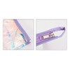 A purple travel cosmetic bag with an iridescent panel and a zip closure, featuring a small loop for carrying.