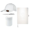 A white cap, a silver pen, a white mug, and a white notebook with a logo.