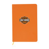 An orange A5 notebook with a logo on the front and a yellow elastic closure.