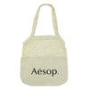 A light beige cotton shopping tote with a mesh top section and a logo on the front.