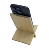 A bamboo phone stand in a natural finish, holding a smartphone at an inclined angle.