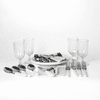 A picnic set features white-handled cutlery, glass tumblers, and serving platters on a white background.