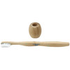 A bamboo toothbrush with a white bristle head and a matching bamboo holder. Both items have a natural finish.