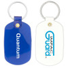 A blue and white oval keychain featuring a branding logo on one side. The keychain has a metal ring attached.