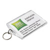 A clear hotel keychain featuring a logo and details for Ibis Styles Adelaide Manor, attached to a metal ring.