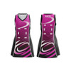 A women's A-line netball dress in pink and black, featuring a logo and a stylish design.