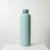 A drink bottle with a smooth, mint green finish and a rounded cap, featuring a minimalistic design.