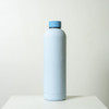 A drink bottle in soft blue with a matching cap, featuring a simple design and a logo on the side.