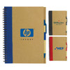 A recycled paper notebook with a spiral binding, featuring a blue, black, and red cover, each with a logo.