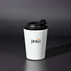 A drink bottle with a white body and black lid, featuring a logo on the front.