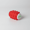 A red Whirl Popper Spinner with a textured surface and end caps, featuring a logo.