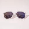 Clear frame sunglasses with dark lenses, featuring a sleek design and subtle branding.