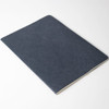 A notebook with a textured navy blue cover, featuring a plain design and an unembellished interior.