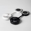 A black and a white rechargeable fan with a magnetic base, featuring circular blades and sleek design.