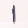 A blue ballpoint pen with a silver tip and clip, featuring a logo on its body.