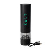 A black rechargeable salt grinder with a transparent chamber and a USB charging cable.