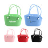 A set of EVA holes pet bags in green, blue, pink, red, and black with handles and a logo on some bags.