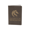 A dark grey eco notebook with a textured cover and a logo on the front. It features gold lettering and branding.