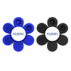 A novelty item featuring two flower-shaped pieces, one in blue and one in black, both with textured surfaces and a central logo.