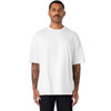 A white oversized tee is worn by a man with tattoos, featuring a simple design and a comfortable fit.