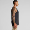 A sleeveless black singlet worn by a man, showcasing a side view and intricate arm tattoos. The singlet has a logo.