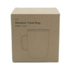 A travel mug in a kraft box, featuring a simple design and a handle. The mug is shown in a plain outline.
