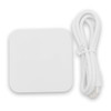 A white wireless charging dock with a matching cable. The dock has a smooth, square design.