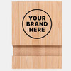 A bamboo phone holder with a circular area for branding, featuring a natural wooden finish.