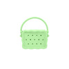 A green silicone bag with holes and a textured handle, featuring a scalloped design.