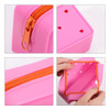 A pink silicone pencil case with orange zipper and heart-shaped holes, featuring an interior compartment.