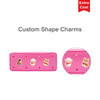 A pink silicone pencil case featuring heart-shaped holes and animal-shaped charms, with a logo on the side.